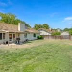 backyard with a tiled roof and a covered patio